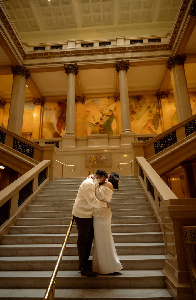Engagement session at Carnegie Museum of Art featuring couple on textured stone staircase with editorial composition