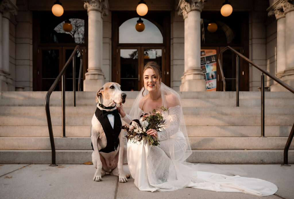 Emotional wedding photos with dog walking with couple during portraits in Pittsburgh