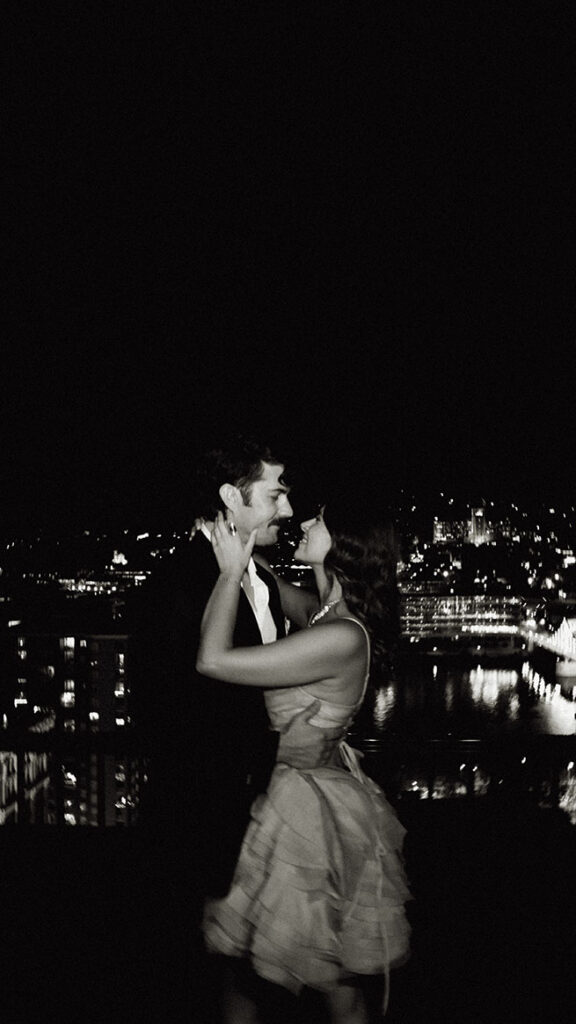 Intimate rooftop couple photo overlooking Pittsburgh skyline