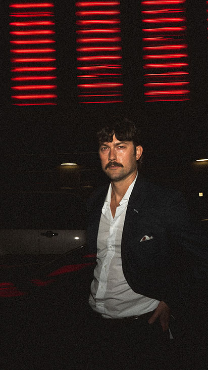 Fashion inspired engagement portrait at night in downtown Pittsburgh