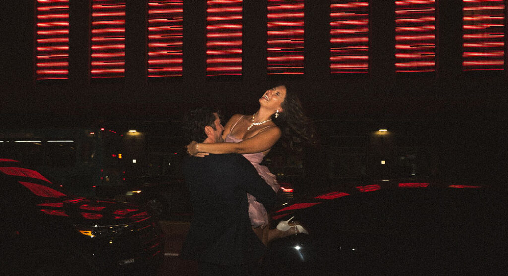 Editorial flash couple photo at night in downtown Pittsburgh with cinematic lighting