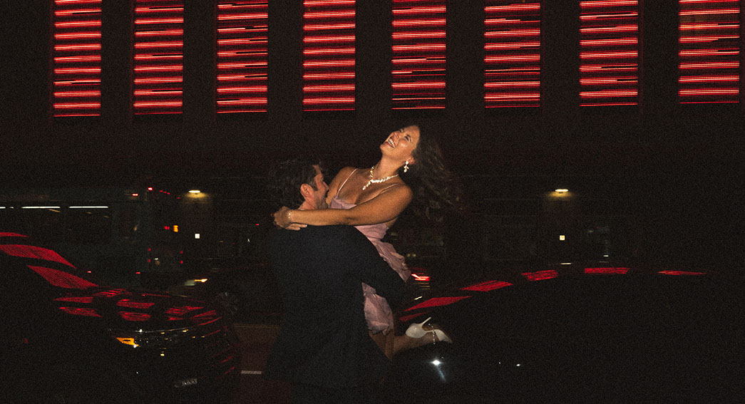 Editorial flash couple photo at night in downtown Pittsburgh with cinematic lighting