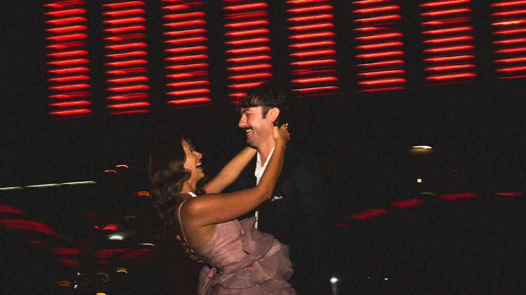Couple laughing during city night photoshoot in Pittsburgh