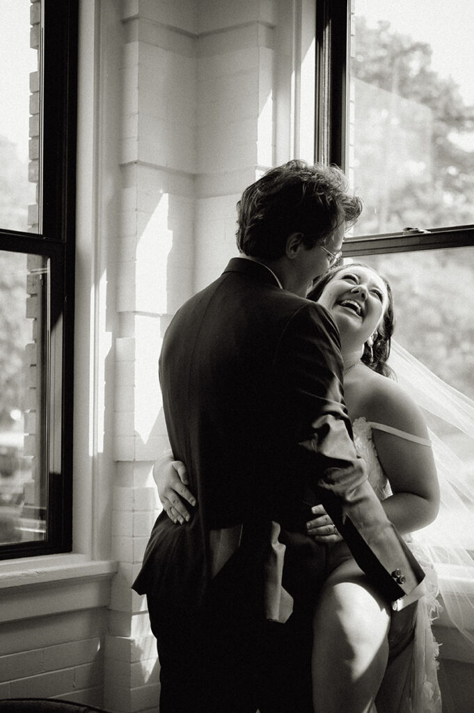 Bride laughing as groom looks at her after her wedding vows in pittsburgh