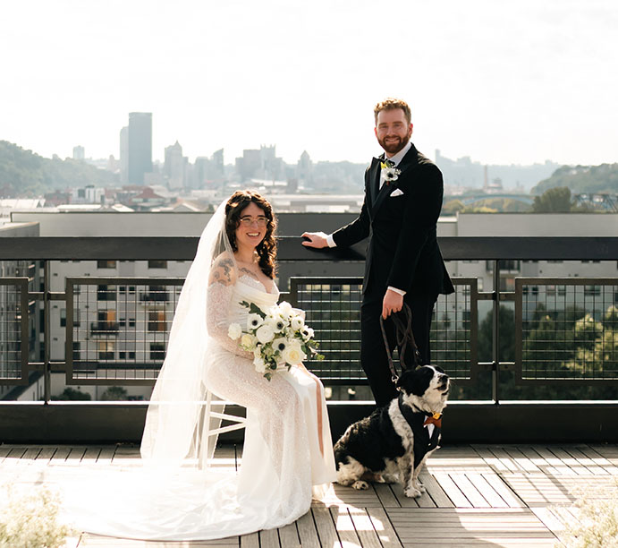 Couple including dog in wedding portraits in Lawrenceville Pittsburgh with urban aesthetic