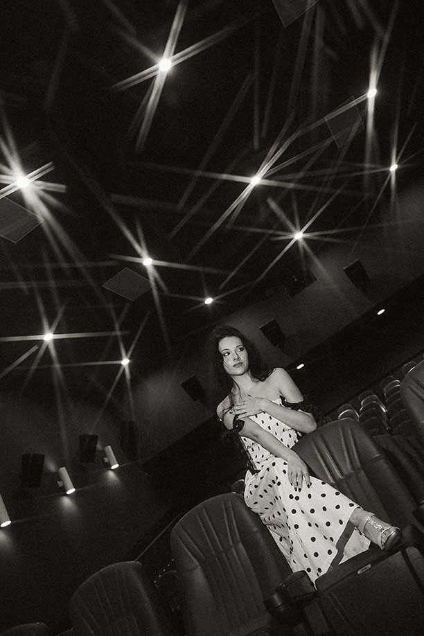 Artistic senior photos in Pittsburgh at night with dramatic lighting and movement