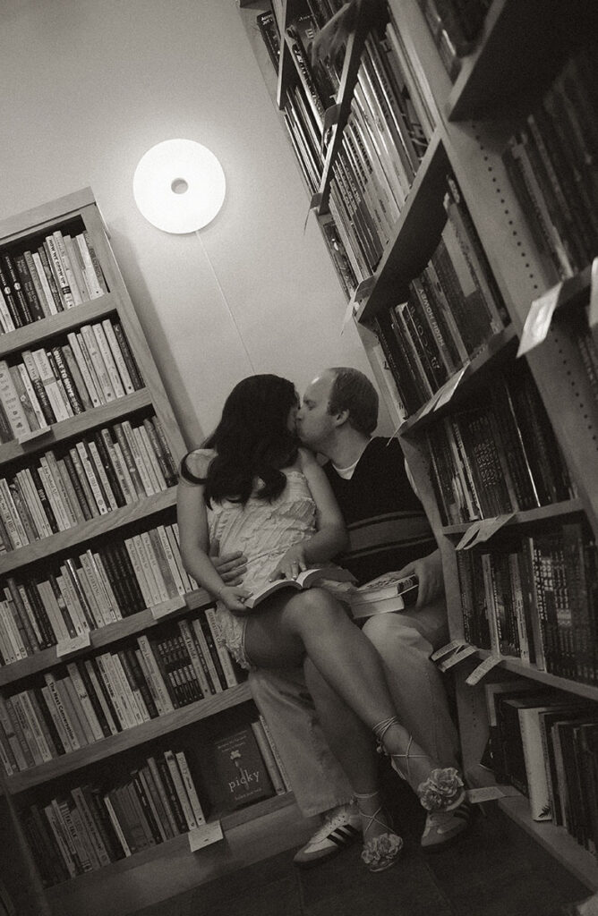 Romantic engagement photos inside independent bookstore