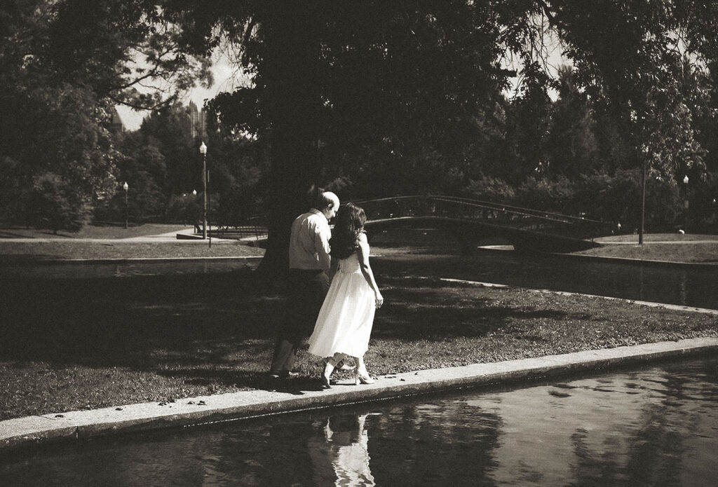Couple walking through Allegheny Commons Park during Pittsburgh engagement session