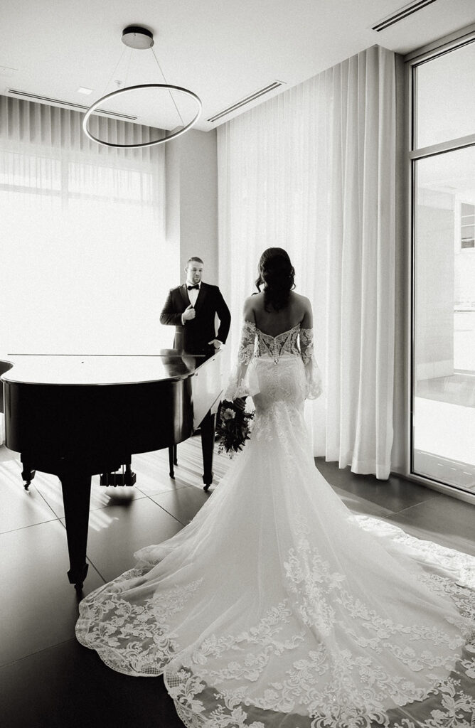 Editorial bridal portrait beside grand piano in Pittsburgh.