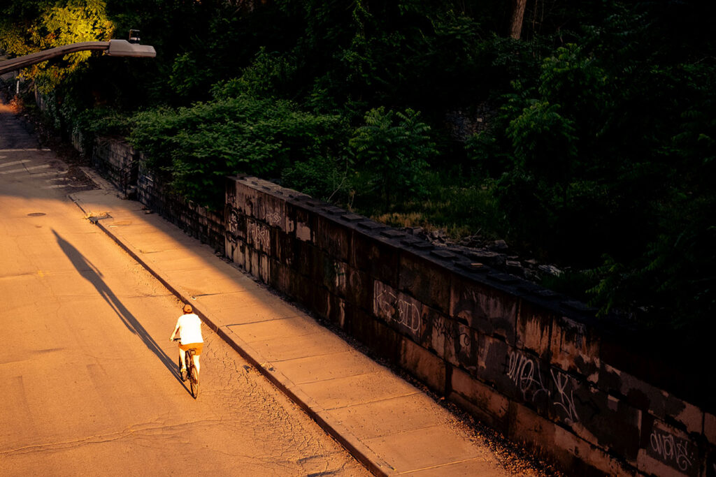 Man on a bike in South Side during the Summer months in Pittsburgh