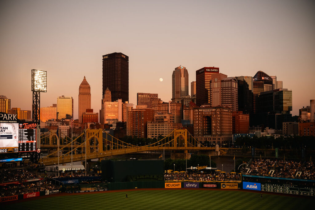 Summer evening at a Pittsburgh Pirates game with city skyline views