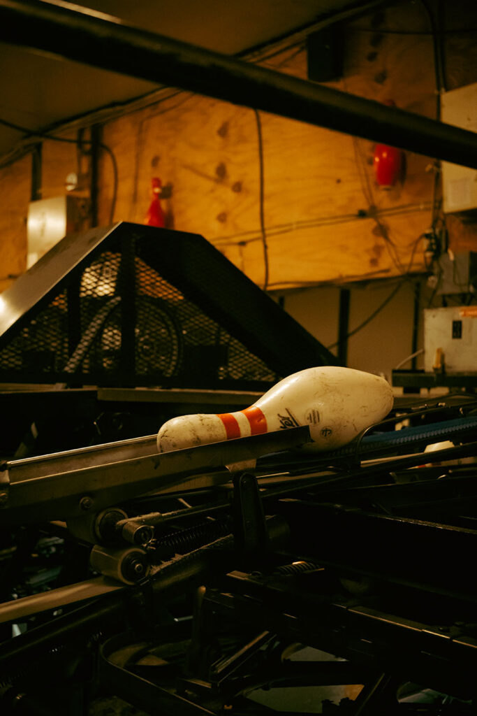 Behind-the-scenes view of Arsenal Bowl bowling machinery