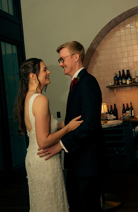 Newlyweds laughing together during a candid reception moment at Balvanera in Pittsburgh.